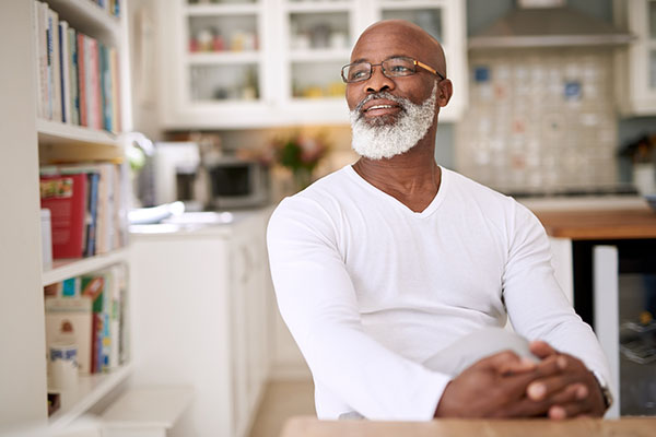 Shot of a mature man looking thoughtful at home